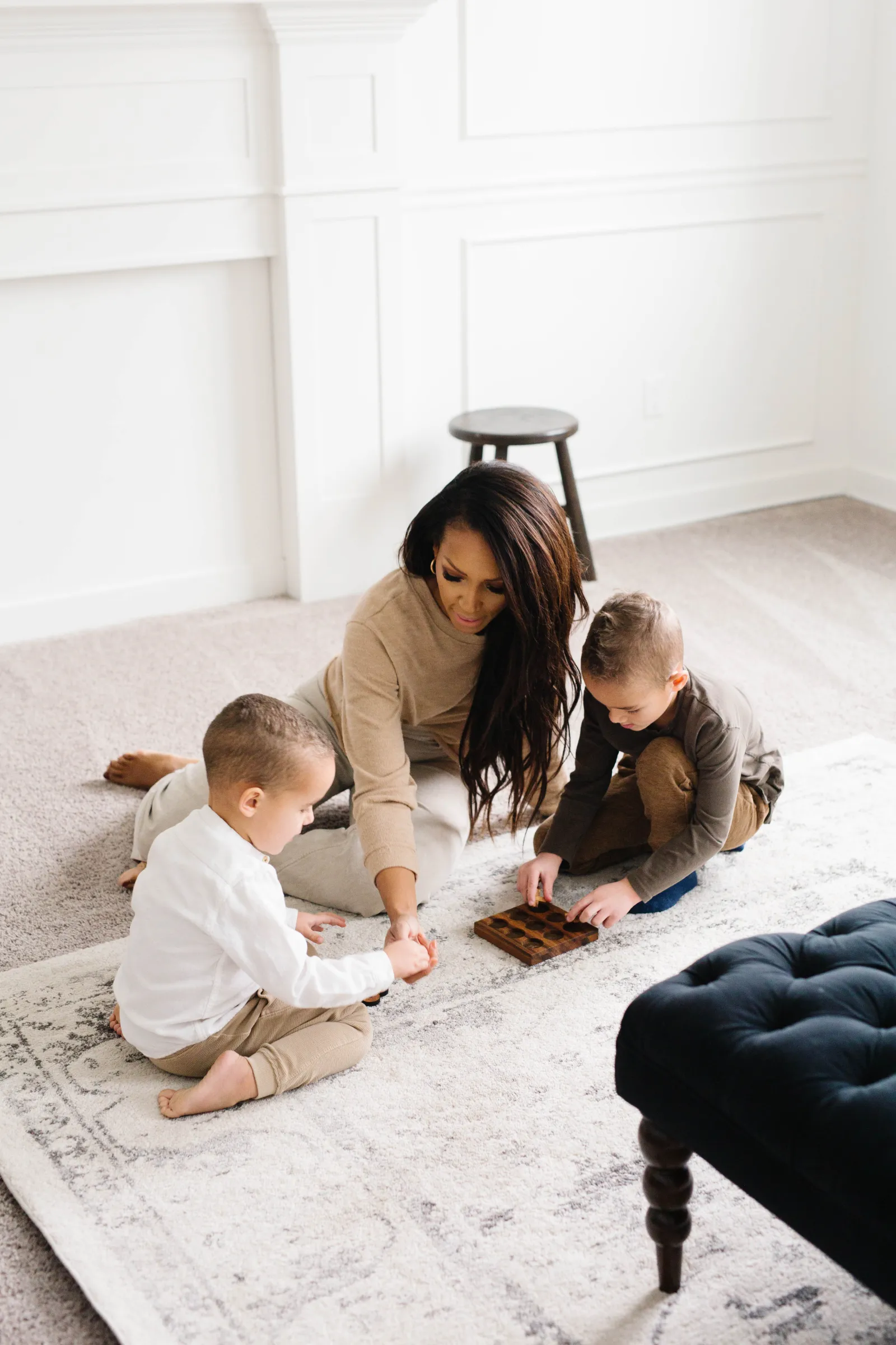 mom playing on floor with kids