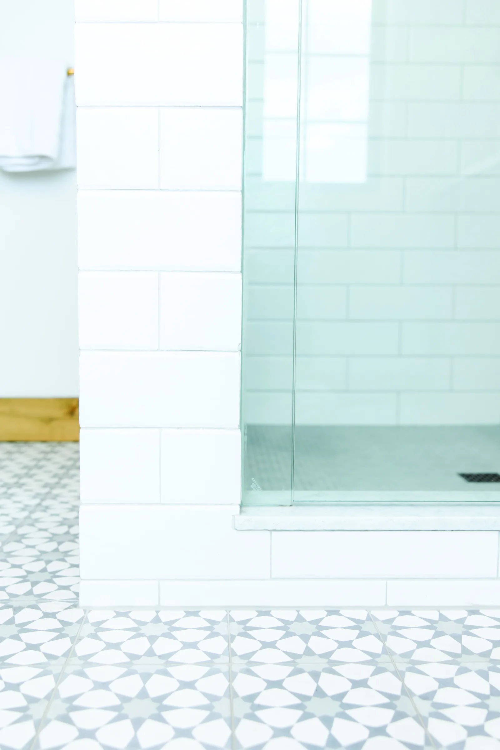 tile with shower door and white tile