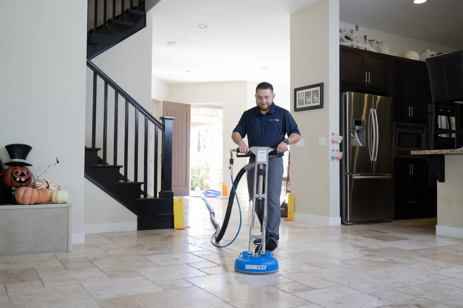 man cleaning tile and grout