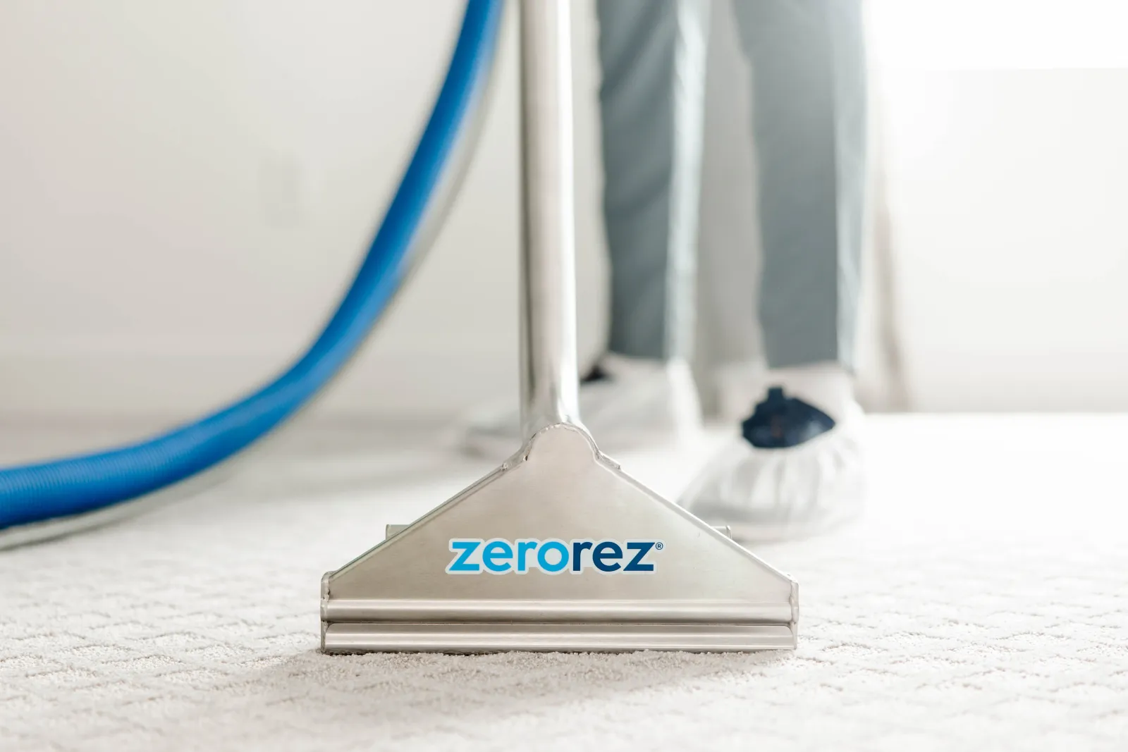 carpet cleaning wand on cream carpet