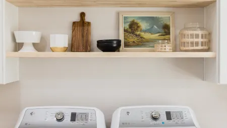 a white shelf with white shelves